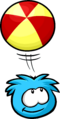 A blue puffle playing with its ball.