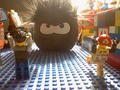 A black puffle "invading" a LEGO land.