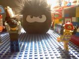 A black puffle "invading" a LEGO land.