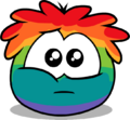 A Rainbow Puffle with puppy eyes.