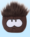 A Black Puffle plush toy (originally known as a brown puffle)