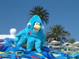 Squidzoid on an umbrella at the beach.