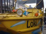 A viking penguin on a boat.