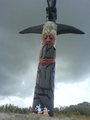 A Rescue Squad penguin, a viking penguin, and Gamma Gal standing near a totem pole.