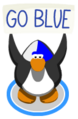 A penguin doing the wave action with the Blue Face Paint on causing it to hold up a sign that says GO BLUE.