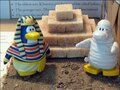 King Ra-Ra and Boris standing near a pyramid.