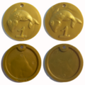 A comparison of a deluxe coin code mold (pictured on the right), with a regular coin code (pictured on the left).