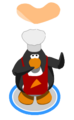 A penguin flipping pizza.